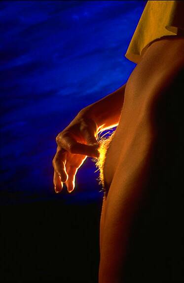 photo of young woman with light radiating from her clitoris