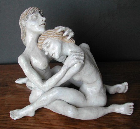 Two women in a compassionate embrace